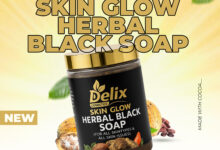Delix Skin Glow Herbal Black Soap bar on a natural background
